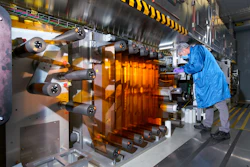 General Motors Fuel Cell Controls and Process Engineer Joe Truchan operating a coating machine