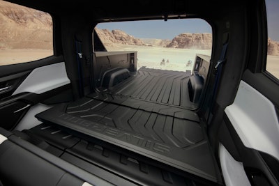 Bed too short? The Multi-Flex Midgate on the all-electric 2024 Silverado RST drops down to allow for longer items.
