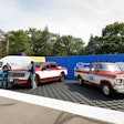 Jay Leno, left, and Walmart CEO John Furner revealed a one-off Ford F-150 Lightning built to honor late Walmart founder Sam Walton who drove a 1979 F-150 Custom shown on the right. Walton's actual truck remains on display at The Walmart Museum in Bentonville, Arkansas.