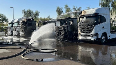 hose still spraying the burned nikola semi truck