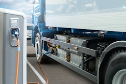 Battery electric truck charging at a power station