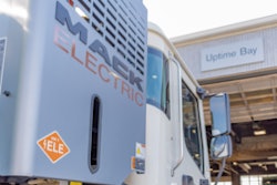 Mack electric truck pulling into shop