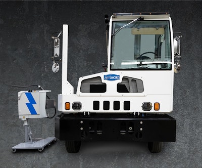 An Autocar terminal truck with a Rocsys hands-free charger