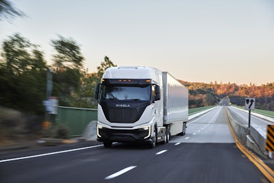 A Nikola semi truck driving on a highway