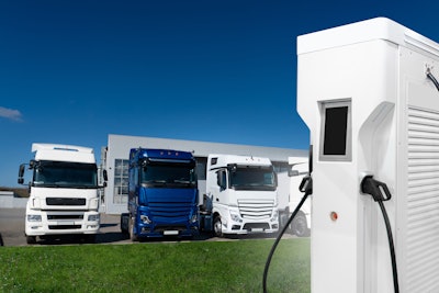 EV trucks parked at charger