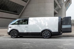 A white Canoo van with the cargo doors open