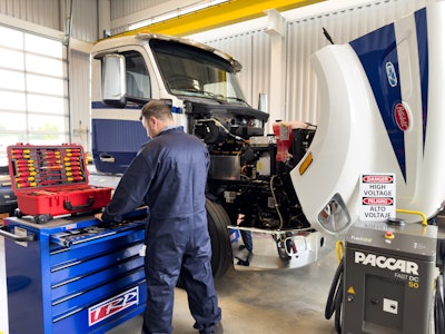 A mechanic working on a truck.
