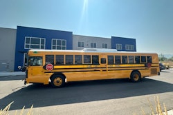 A school bus parked in front of a building