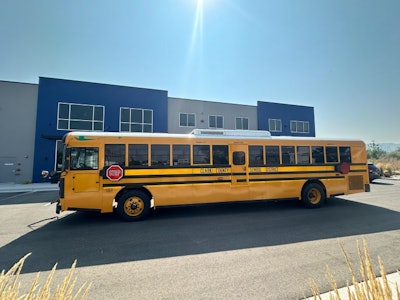 A school bus parked in front of a building