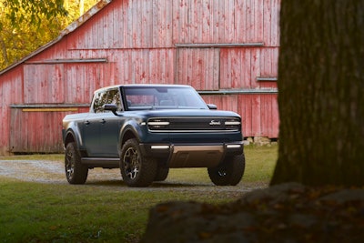 front view Scout Terra pickup beside red barn