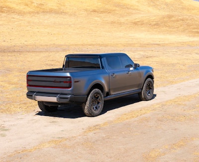 bluish gray Scout Terra pickup truck rear sideview in desert
