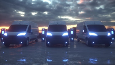 A rendering of battery-electric commercial vans parked at charging stations.