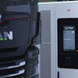 A battery-electric MAN truck connected to an ABB E-mobility 1.2 MW charging station.