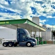 A hydrogen fuel cell Class 8 is shown at a green hydrogen refueling station.