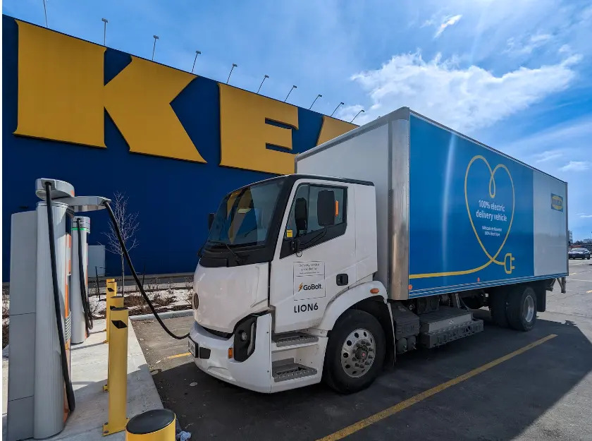 An IKEA Canada battery-electric delivery truck recharging outside a retail location.