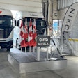 Hydrogen fuel cell and battery-electric semis, built by the now-bankrupt Nikola, parked inside a warehouse in July 2024 to mark the company's entry into the Canadian market.