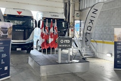 Hydrogen fuel cell and battery-electric semis, built by the now-bankrupt Nikola, parked inside a warehouse in July 2024 to mark the company's entry into the Canadian market.