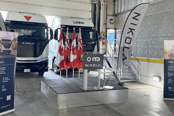 Hydrogen fuel cell and battery-electric semis, built by the now-bankrupt Nikola, parked inside a warehouse in July 2024 to mark the company's entry into the Canadian market.