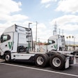 WattEV-branded battery-electric tractors are shown charging at the San Bernardino, Calif. depot, which produces nearly 700,000 kWh of energy monthly.