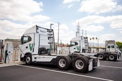 WattEV-branded battery-electric tractors are shown charging at the San Bernardino, Calif. depot, which produces nearly 700,000 kWh of energy monthly.