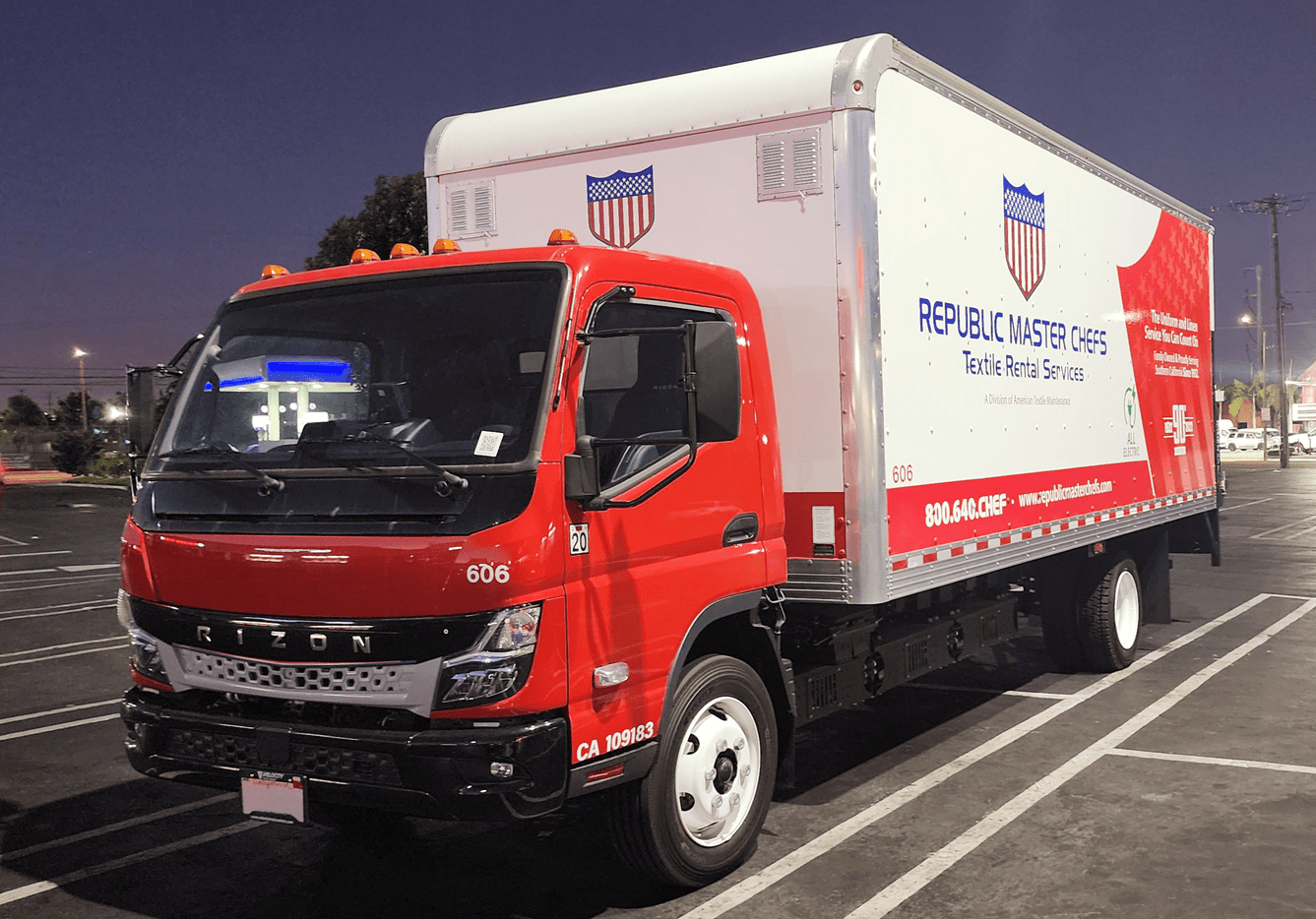 A Rizon medium-duty commercial EV with red and white Republic Master Chefs livery in a parking lot.