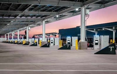 Terawatt Infrastructure's new heavy-duty charging station in Rialto, CA. runs on 100% renewable energy and features 18 fast-charging stalls, 55 bobtail parking stalls, a Wi-Fi-equipped driver lounge, and solar canopies.