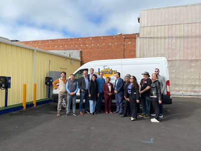 Port Power Founder and CEO Nadav Gur (second from left) poses Oakland Mayor Barbara Lee (center) with Family Laundry employees and city officials.