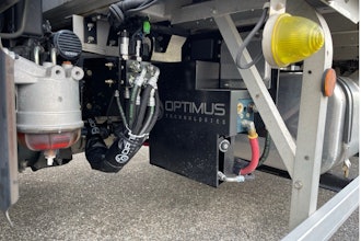 A detailed view of the Optimus Vector System manifold and fuel selector valves on a Hino truck, supporting 100% biodiesel operation in the Optimus–Mitsui partnership.
