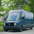 An example of a Rivian Electric Delivery Van (EDV) featuring the Amazon logo parked on a neighborhood street.