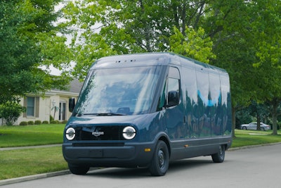 An example of a Rivian Electric Delivery Van (EDV) featuring the Amazon logo parked on a neighborhood street.