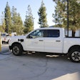A Ford F-150 Lightning from the Helix Water District charges at the new BetterFleet-powered charging depot in El Cajon, California.