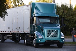 A Volvo VNR Electric with a white trailer participates in City Harvest, New York City's largest food rescue organization, as part of the Bronx is Breathing project.