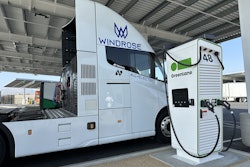 The Windrose Global E700 Class 8 battery-electric semi charging at a Greenlane charging station.