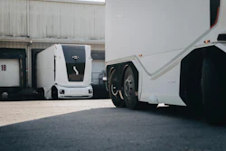 Einride's battery-electric autonomous trucks in action at an industrial warehouse.