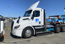 A Freightliner eCascadia truck from PG&E's fleet is shown charging at an ABB eMobility charger.