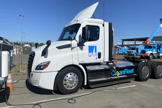 A Freightliner eCascadia truck from PG&E's fleet is shown charging at an ABB eMobility charger.