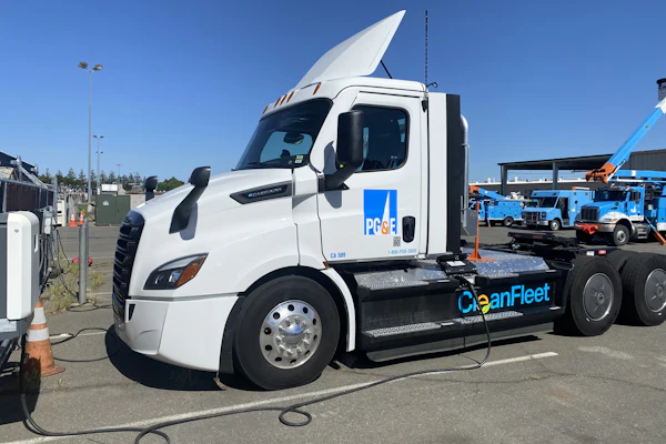 A Freightliner eCascadia truck from PG&E's fleet is shown charging at an ABB eMobility charger.
