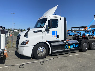 A Freightliner eCascadia truck from PG&E's fleet is shown charging at an ABB eMobility charger.