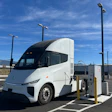 A white Windrose R700 semi-truck connected to a Kempower MCS charger at EV Realty's San Bernardino hub.