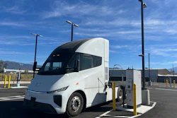 A white Windrose R700 semi-truck connected to a Kempower MCS charger at EV Realty's San Bernardino hub.