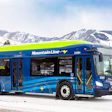 A Mountain Line battery-electric bus parked in snow-covered Missoula, Montana.