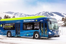 A Mountain Line battery-electric bus parked in snow-covered Missoula, Montana.