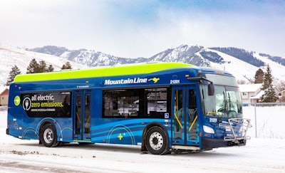 A Mountain Line battery-electric bus parked in snow-covered Missoula, Montana.