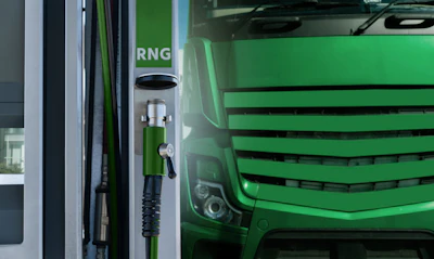 A rendering of an RNG-powered truck at a refueling station.