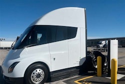 A white Tesla Semi is charging at Tesla's first public Megacharger in Ontario, California.