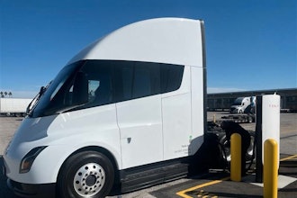 A white Tesla Semi is charging at Tesla's first public Megacharger in Ontario, California.