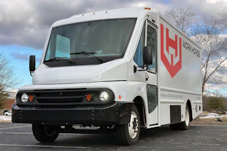 A white Workhorse W56 battery-electric step van parked outside.