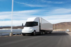 A rendering of a white Tesla Semi pulling a trailer along a scenic coastal highway.