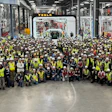 Tesla Semi production line workers pose with the first completed Semi at Gigafactory Nevada.
