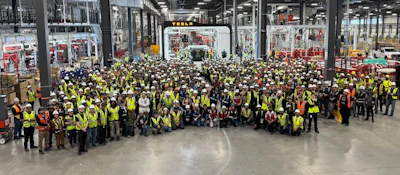 Tesla Semi production line workers pose with the first completed Semi at Gigafactory Nevada.